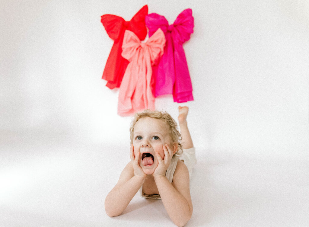 child sticking out tongue for photo