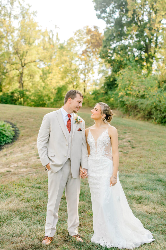 Alexis and Payton laughing together during their October wedding photographed by an Indianapolis wedding photographer