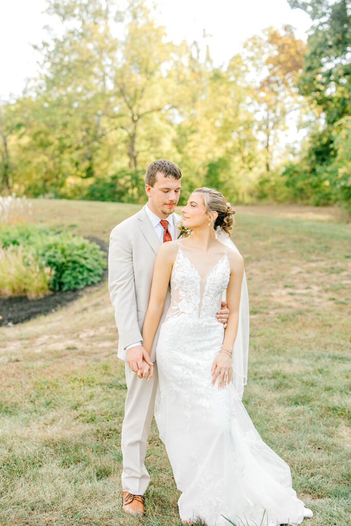 Alexis and Payton laughing together during their October wedding photographed by an Indianapolis wedding photographer