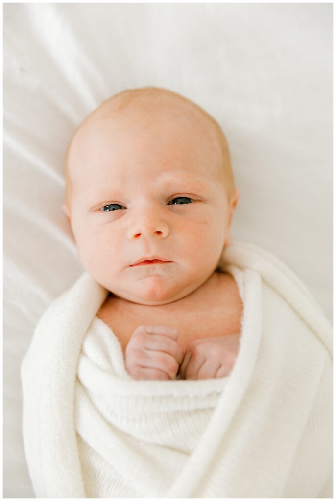 Close-up of newborn baby hands and face during studio session in Indianapolis