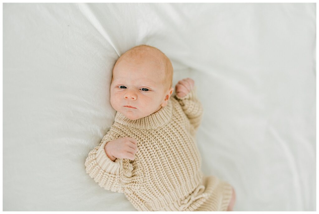 Newborn baby posed on beanbag with neutral tones Indianapolis newborn photographer