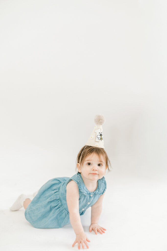 First birthday photoshoot of baby girl in simple studio setup