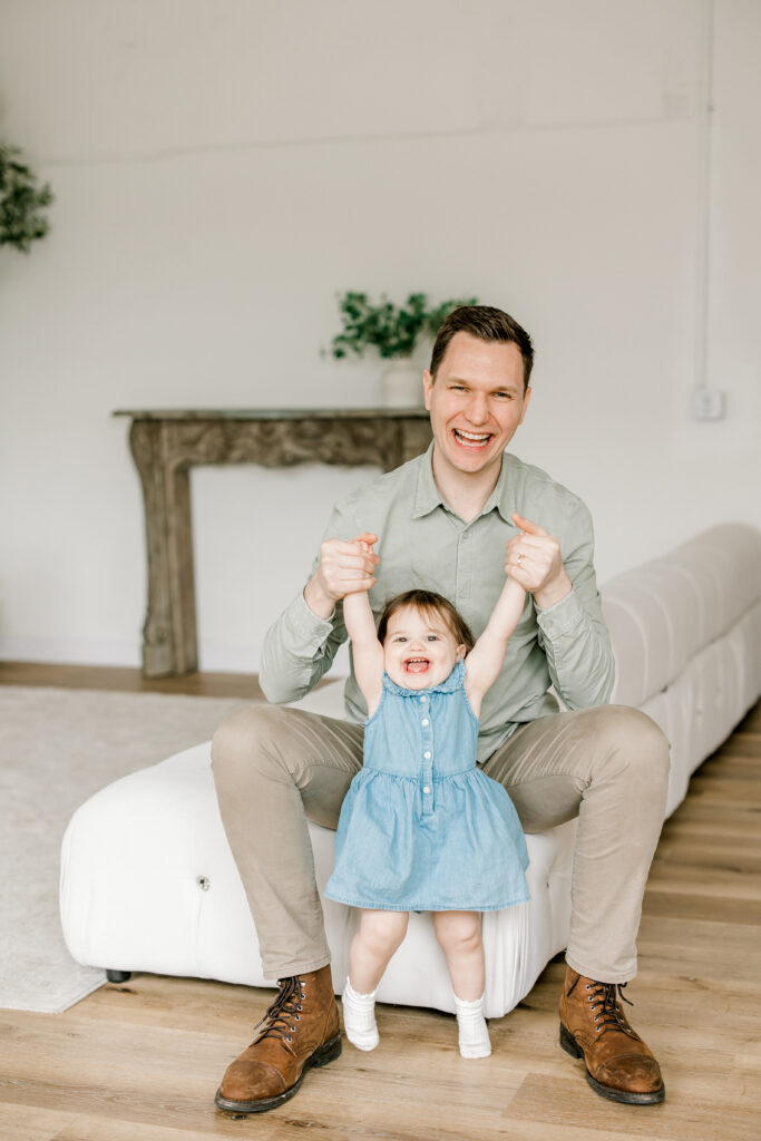 Baby Darcy laughing during first birthday photoshoot in studio