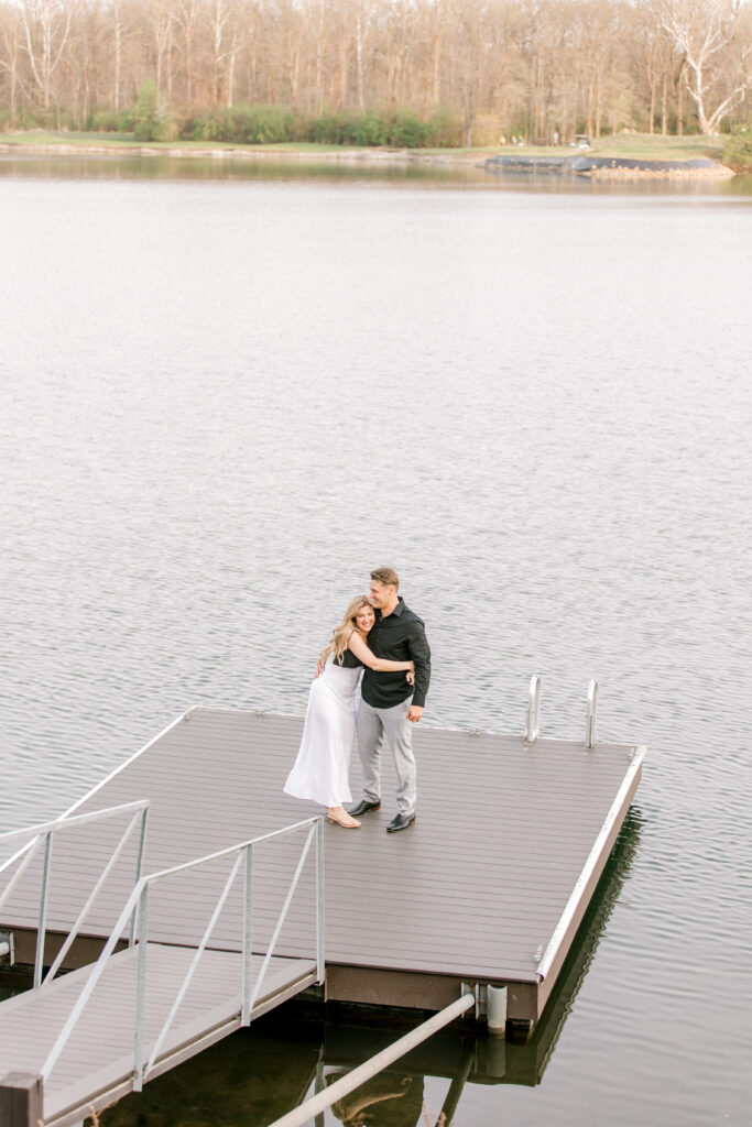 Candid moment of bride-to-be saying yes during Indiana lake house proposal