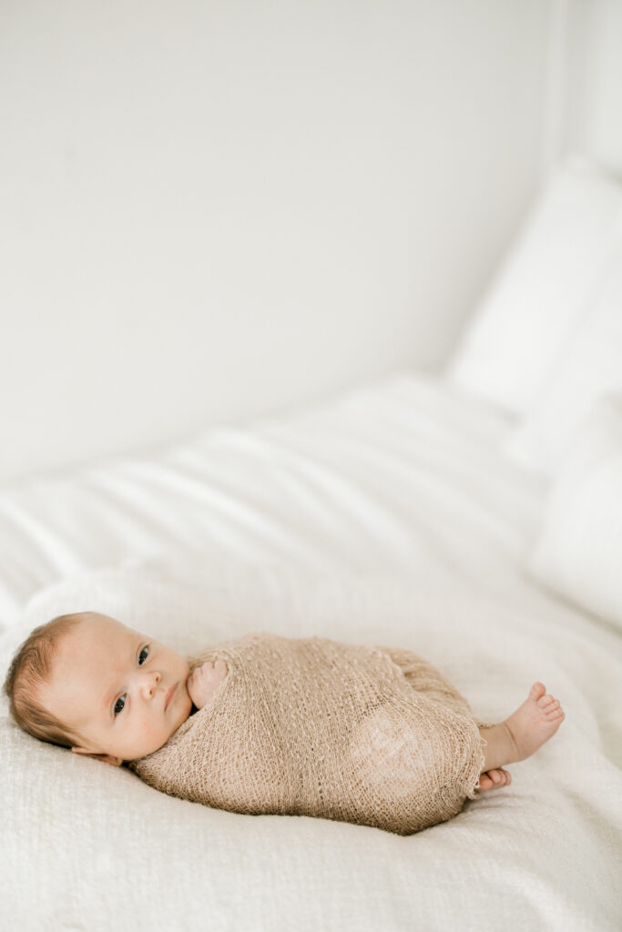 Seven-week-old Baby Beau sleeping in a wrap during downtown Indianapolis newborn session