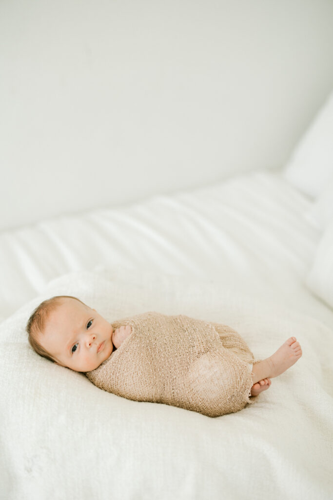 eaceful newborn portrait of Baby Beau with neutral backdrop in Indianapolis studio