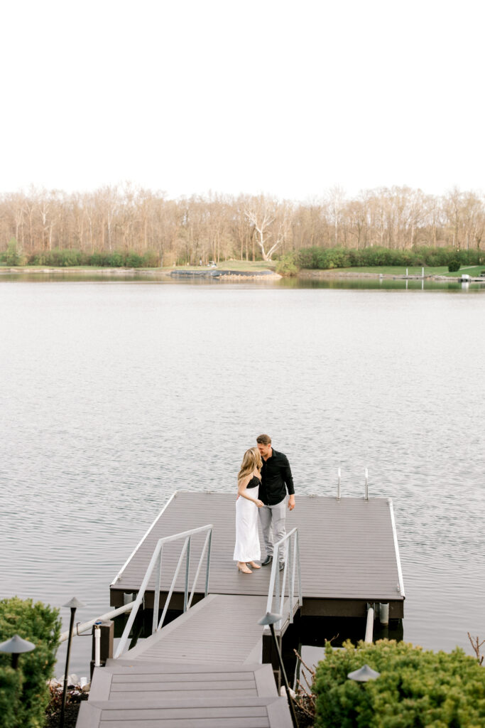 Engaged couple hugging and smiling after romantic proposal in Fishers Indiana