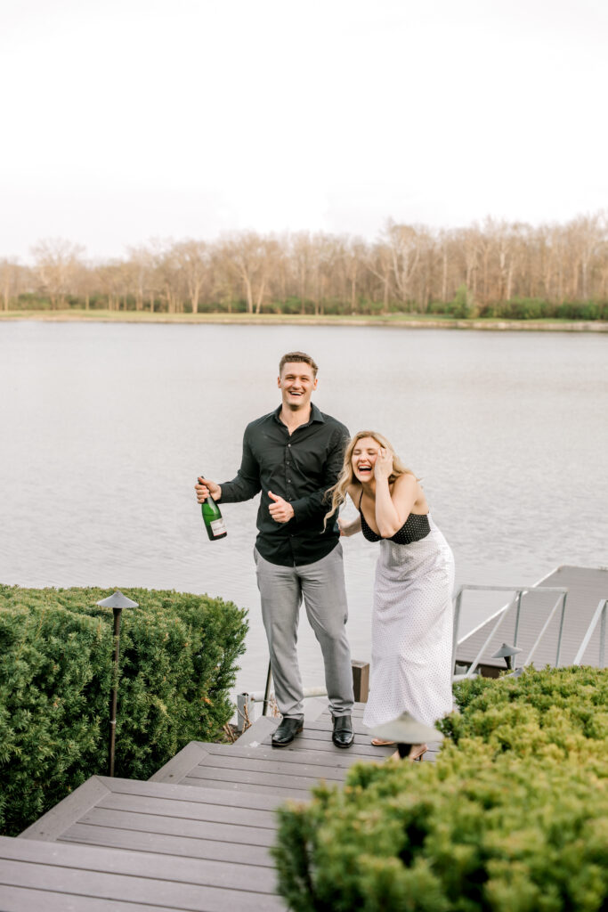 Couple celebrating engagement after proposal in Fishers Indiana by the water